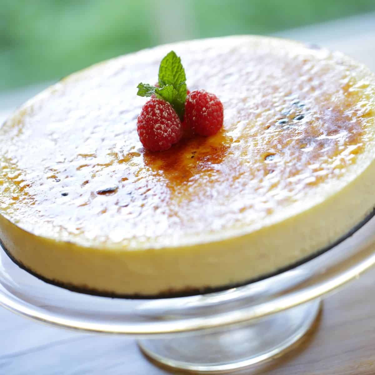 Creme Brulee Cheesecake on a cake stand