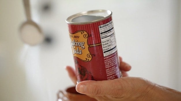 Measuring out baking soda from a can 