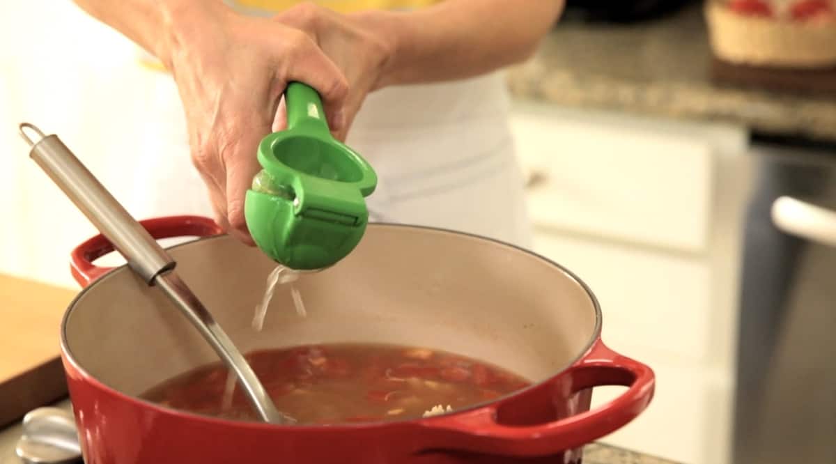 Squeezing Lime Juice into a Red Pot