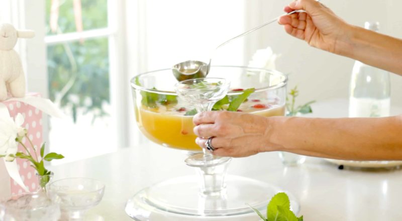 Baby Shower Punch being served into coupe glasses from a punch bowl