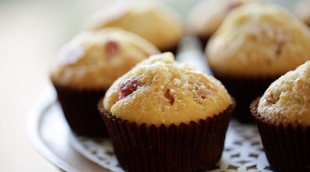 Close up of a strawberry muffin in a brown cupcake wrapper