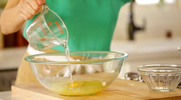 Adding water from a Pyrex Pitcher to a large Mixing Bowl