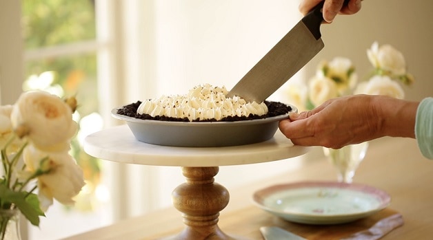 Slicing Chocolate Cream Pie on Pie Stand