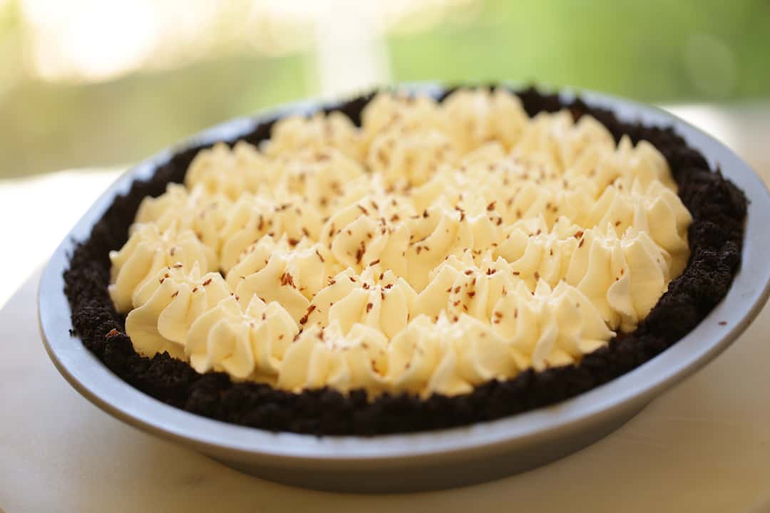 Chocolate Cream Pie in tin on cutting board