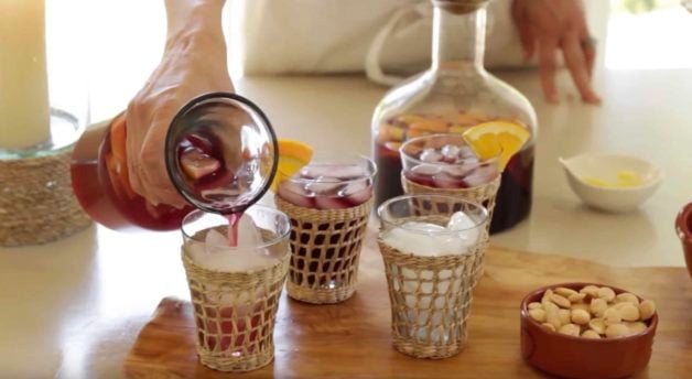 Non-alcoholic sangria being poured into glasses filled with ice