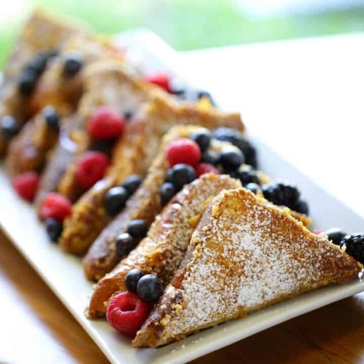 Brioche French Toast with Berries on a White Plate