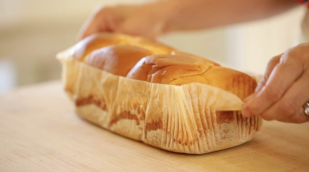 a loaf of brioche bread on a cutting board
