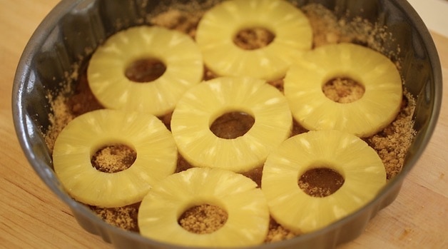 Pineapple Rings in the bottom of a Pineapple Upside down cake pan