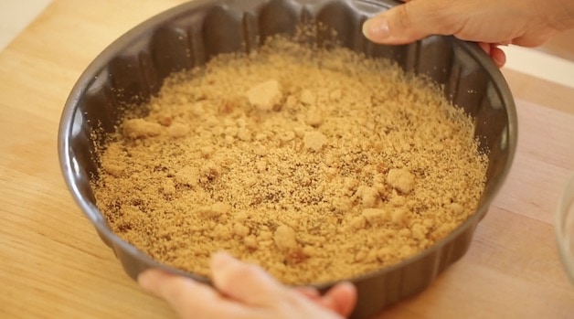 A layer of brown sugar spread on a cake pan