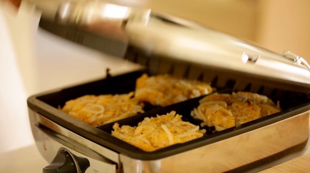  Hash brown Waffles being pressed on waffle iron