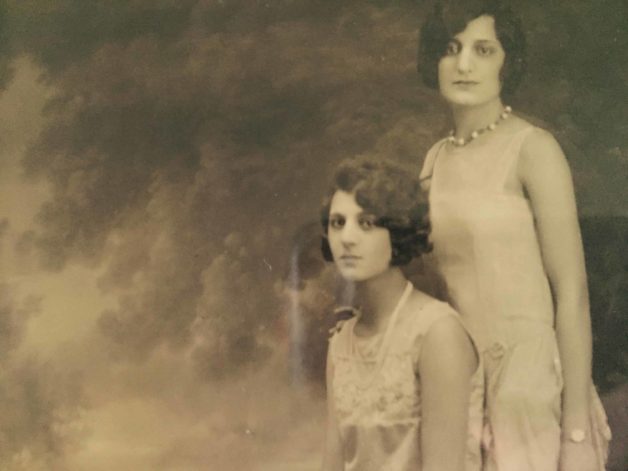 A vintage photo of Two Italian Women in fancy dresses 