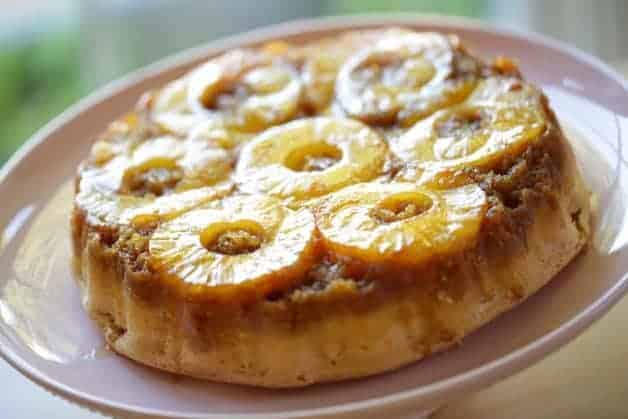 Pineapple Upside Down Cake Recipe on a pink cake stand