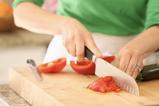 Dicing a red bell pepper on a cutting board