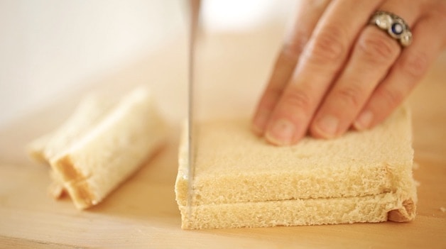 Cutting crusts off sandwich bread