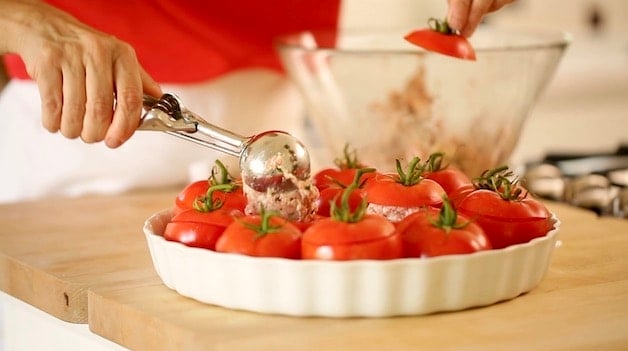 filling cored out tomatos with ground meat with an ice cream scoop