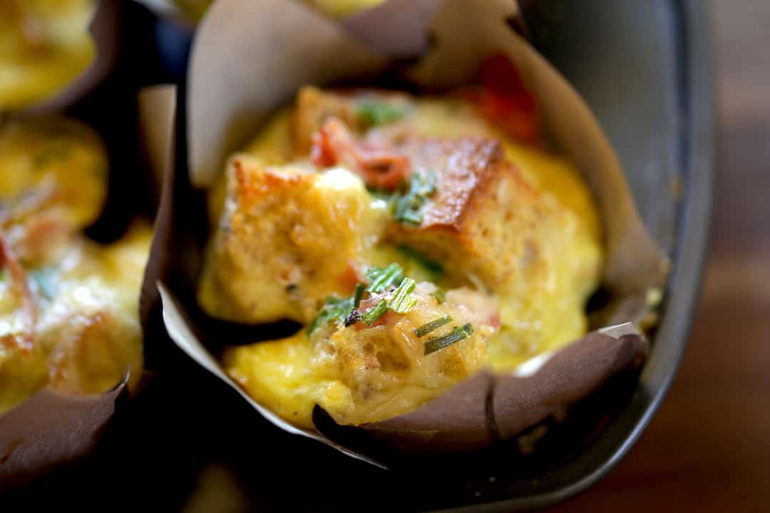 detail of a mini egg strata in a muffin paper