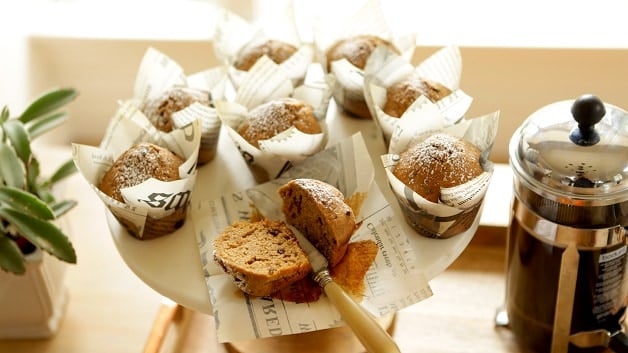 Cappuccino muffins wrapped in paper split in half