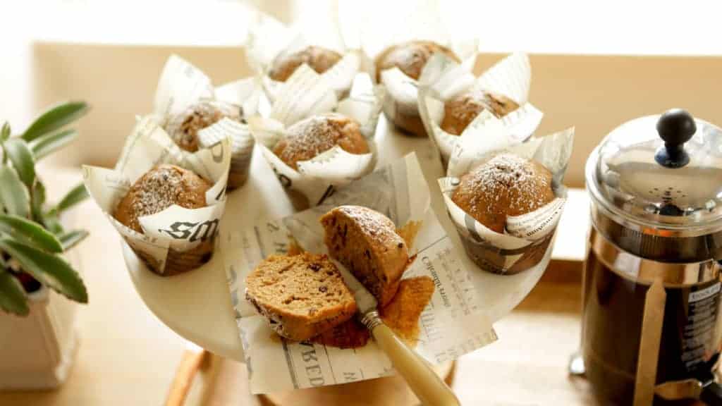 Cappuccino Muffins on a cake stand in newspaper themed muffin papers