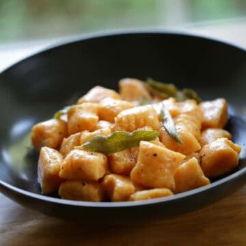Sweet Potato Gnocchi with Brown Butter and Sage in a black bowl