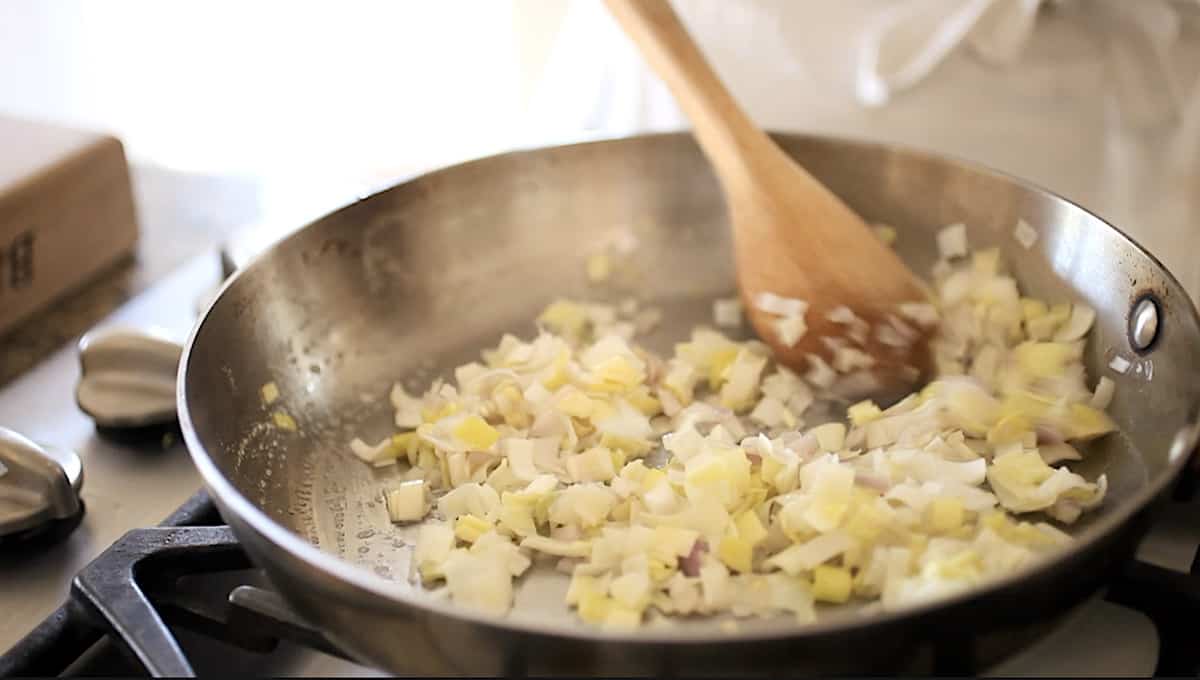 sautéing leeks and shallots in a skillet 