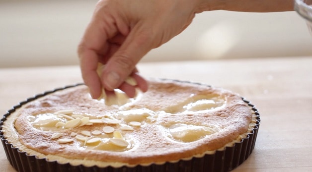 Sliced almonds on top of baked tart