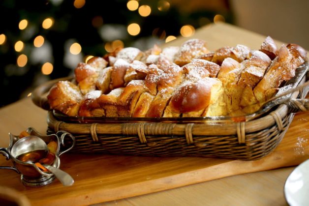 Gingerbread French Toast with Cinnamon Syrup served in a large casserole dish