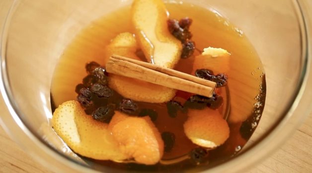 Cinnamon Syrup steeping in bowl for a Gingerbread French Toast Casserole