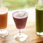 3 Smoothies in a Glass sitting on a Table