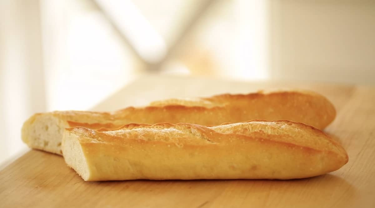 two baguettes on a cutting board