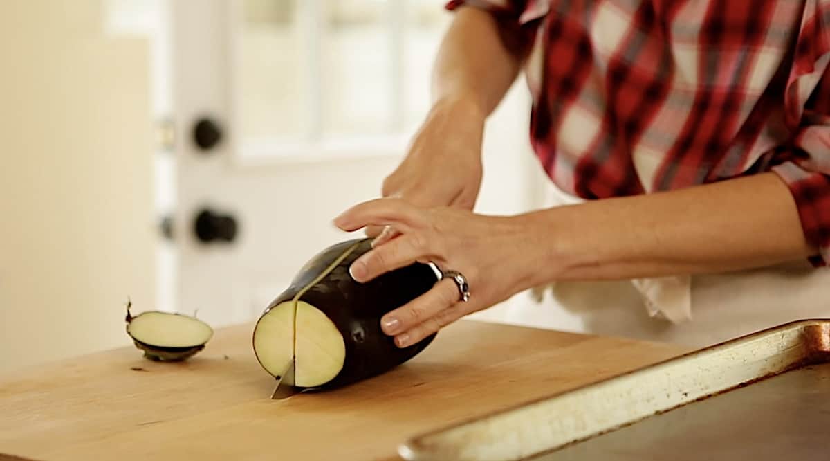 slicing eggplant in half