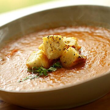 Close up shot of Tomato soup in bowl with Croutons