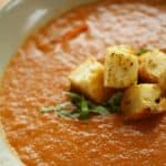 Tomato and Eggplant Soup in a bowl with croutons