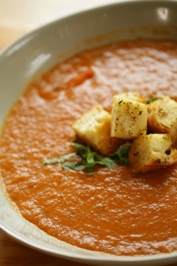 Tomato and Eggplant Soup in a bowl with croutons