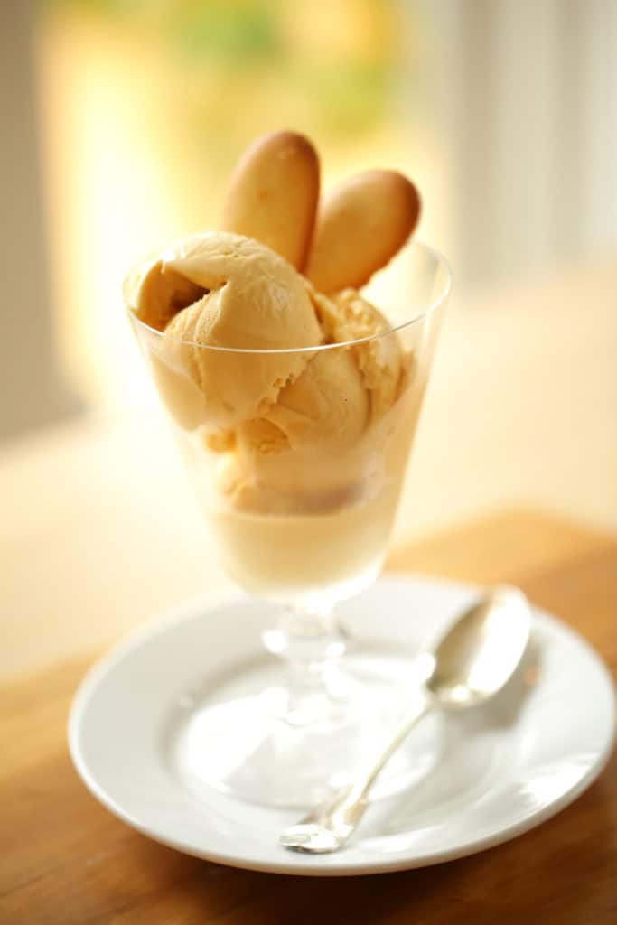 Scoops of Salted Caramel Ice Cream in Glass garnished with Cookies