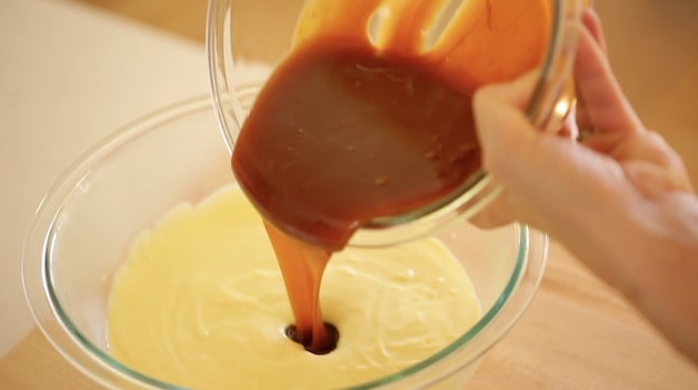 adding caramel to an ice cream custard