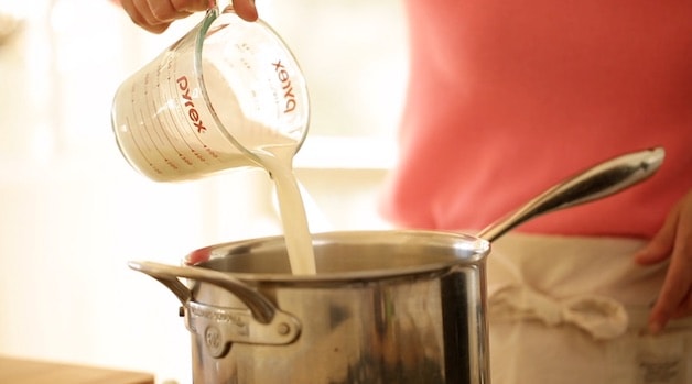 adding cream to a pot