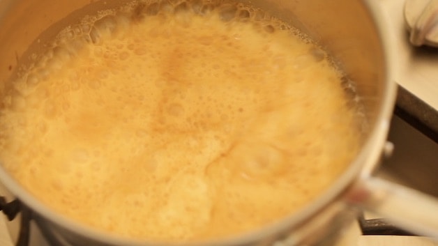 caramel and cream bubbling in a pot