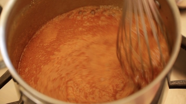 swirling caramel in a pot