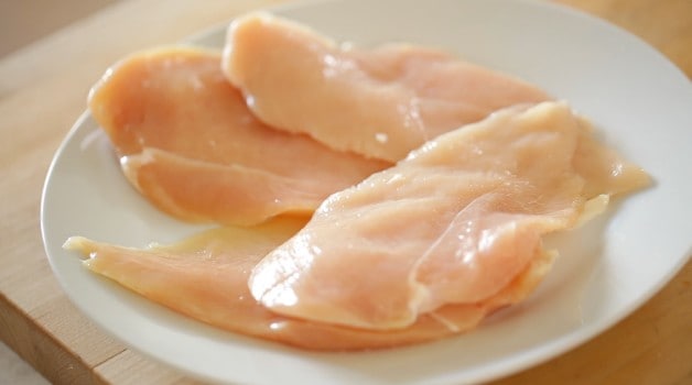 raw chicken breasts on a plate