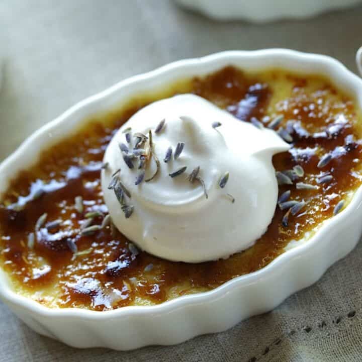 Lavender Creme Brulee in a flutted Ramekin with Whipped Cream on top