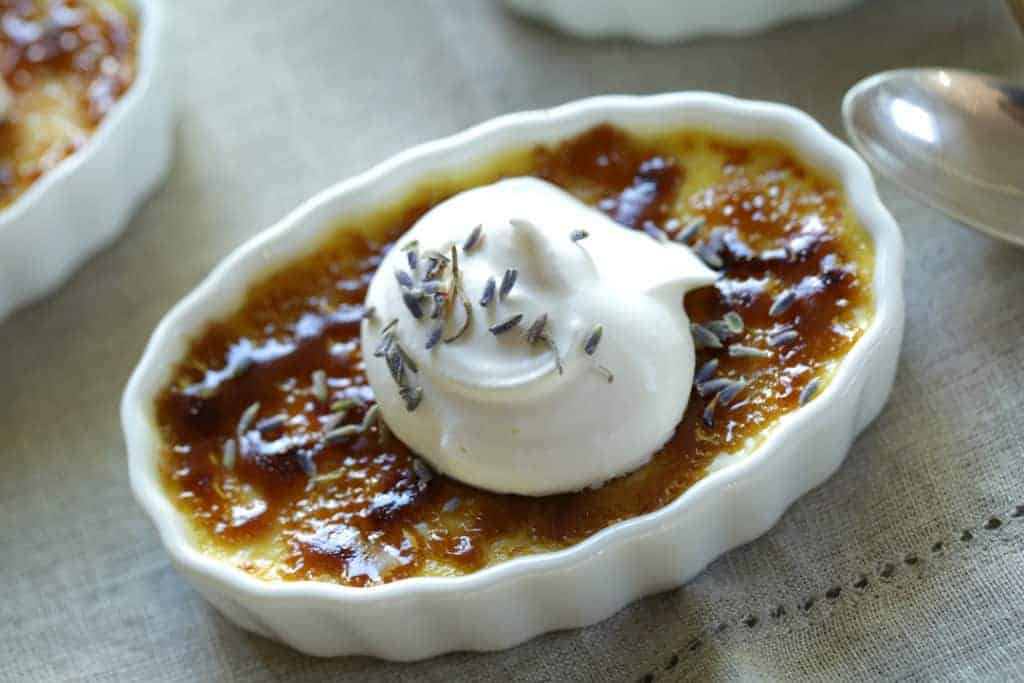 Lavender Creme Brulee Recipe with whipped cream and lavender blossoms 