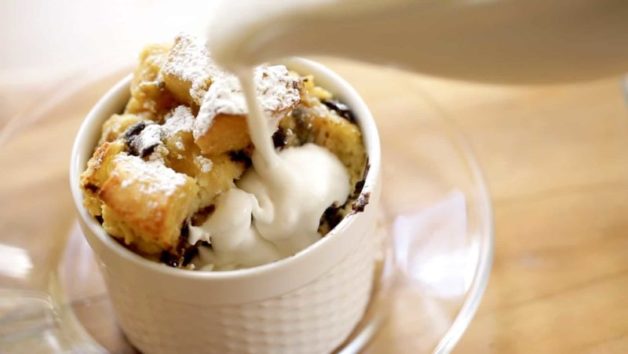 Pourable whipped cream being poured into banana bread puddings