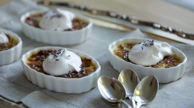 Lavender Creme Brulee Recipe with whipped cream and lavender blossoms 