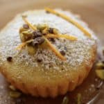 Pistachio Olive Oil Cake on Plate served with garnishes
