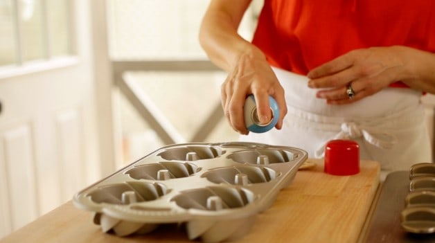 Spraying mini bundt cake tins