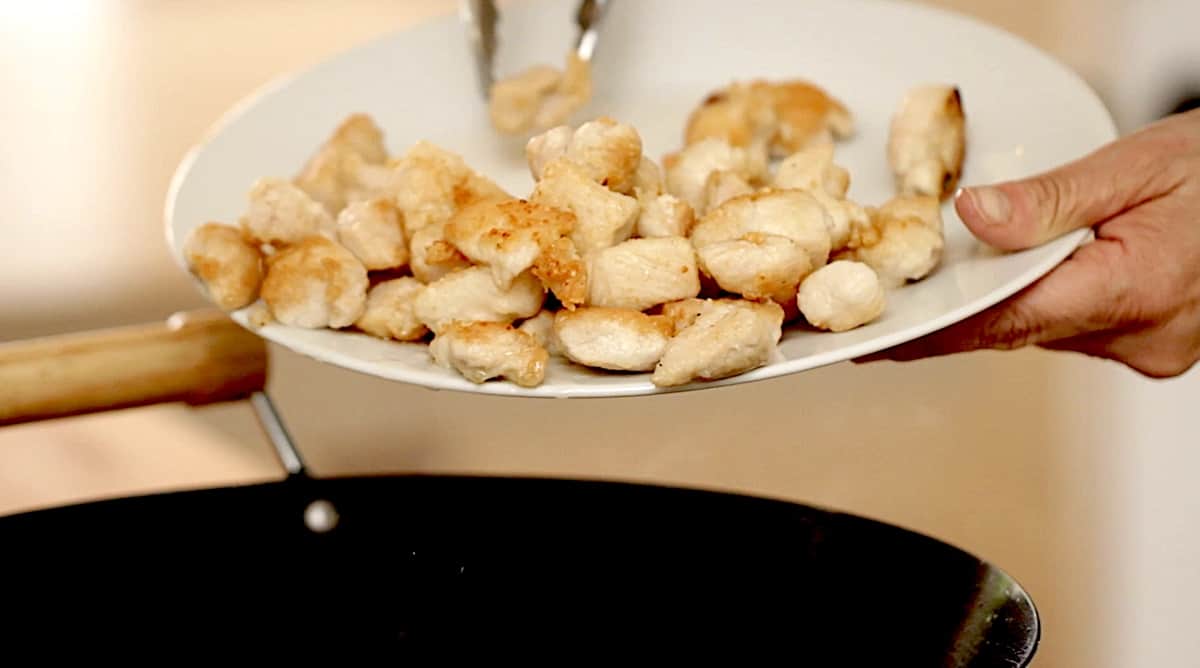 Adding cooked chicken back in the wok