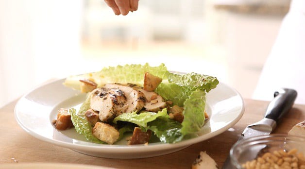 Adding Pinenuts to a chicken caesar salad