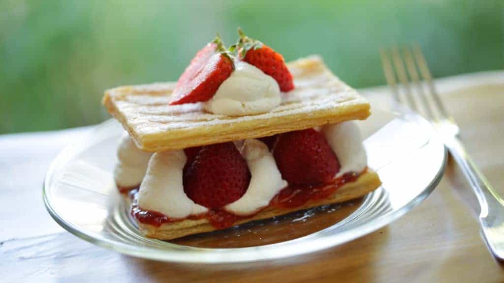 2-layer strawberry napoleon on a glass plate with fork