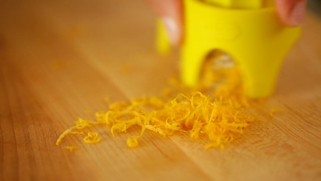 Grated Lemon Zest on a wooden cutting board