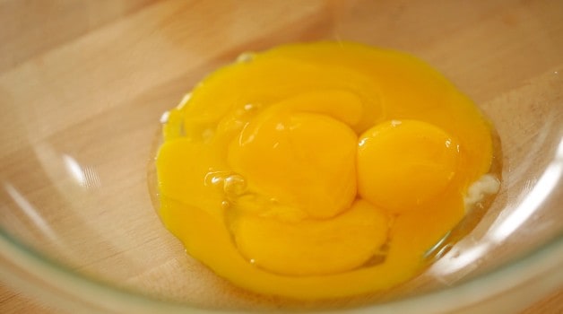 Egg yolks in a clear bowl
